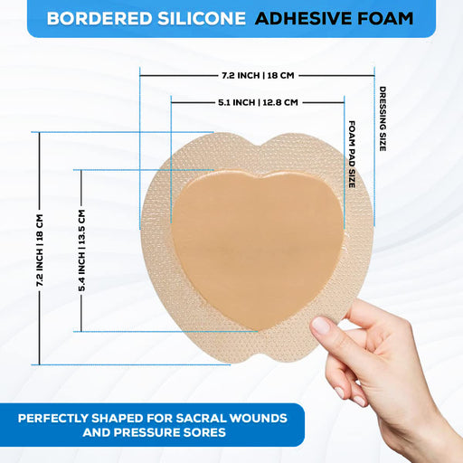 Size guide for a heart-shaped bordered silicone adhesive foam dressing designed for sacral wounds and pressure sores.